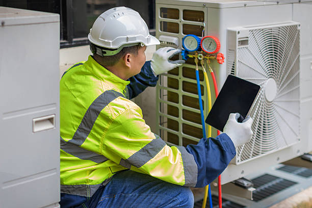 Professional Air Conditioning Repair technician working in Kure Beach, NC